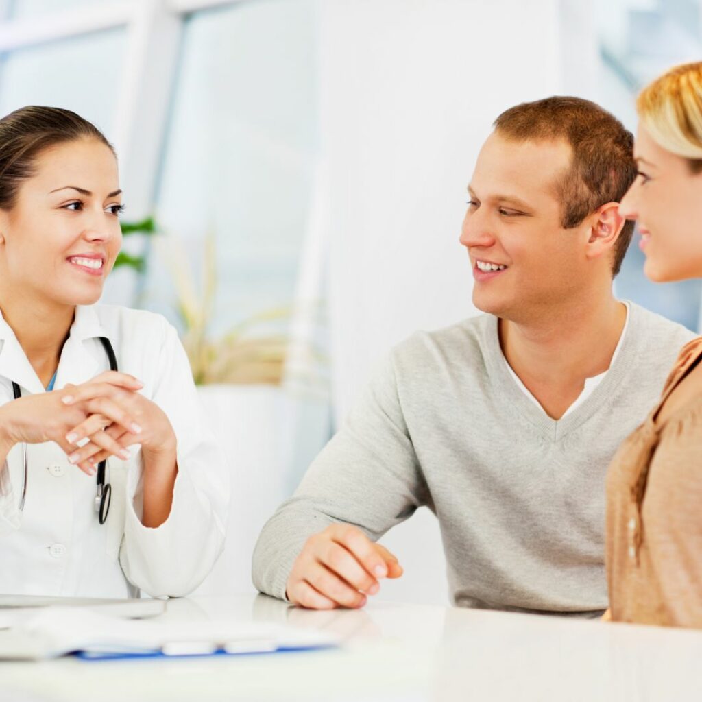 couple speaking with a doctor